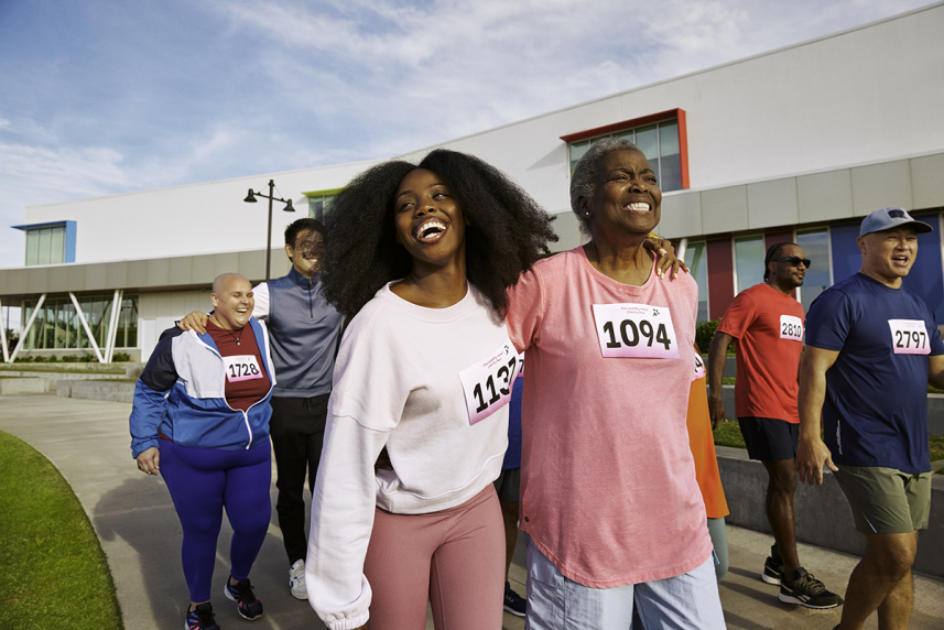 Happy people walking and smiling outdoors