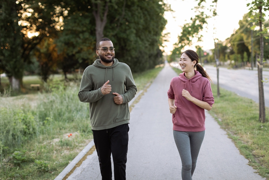 A young woman and man walking outside