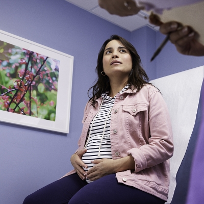 A pregnant women at a doctors office