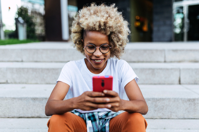 A woman on her phone outside