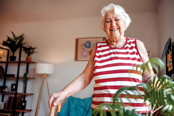 Ann elderly woman walking in her home